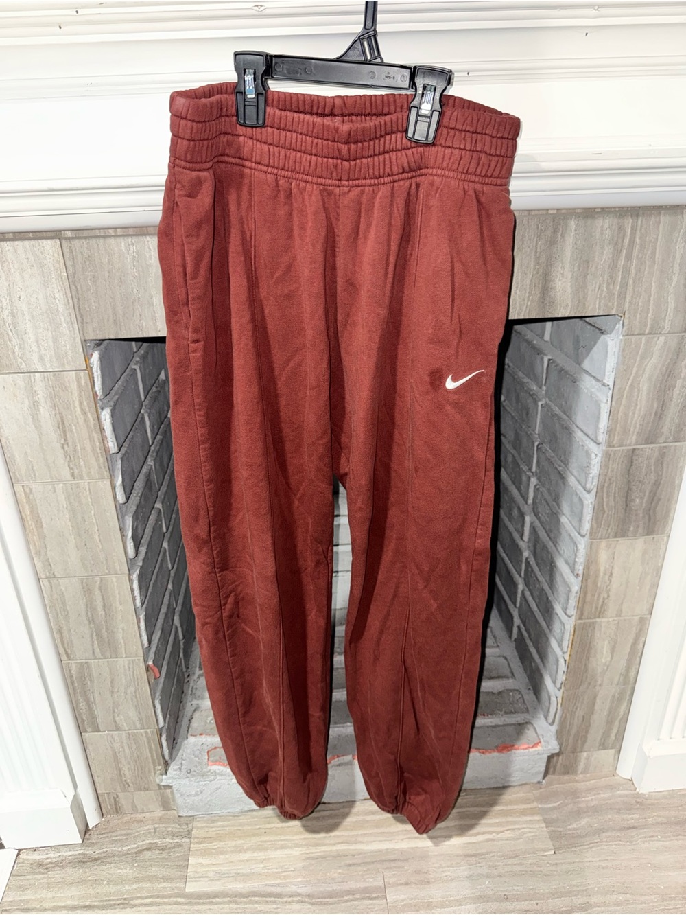 Nike womenโs
Rust Red Sweatpants with White Swoosh